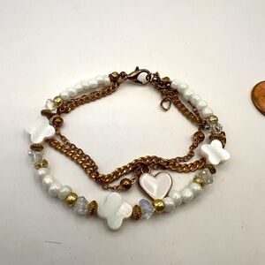 Triple strand Mother of Pearl and gold tone bracelet
